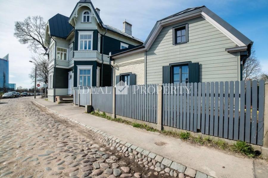 The two-storey private house on the river shore Daugava .