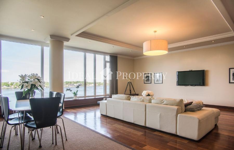 Exclusive two-storey penthouse with floor-to-ceiling windows offers the amazing view to Daugava river. 