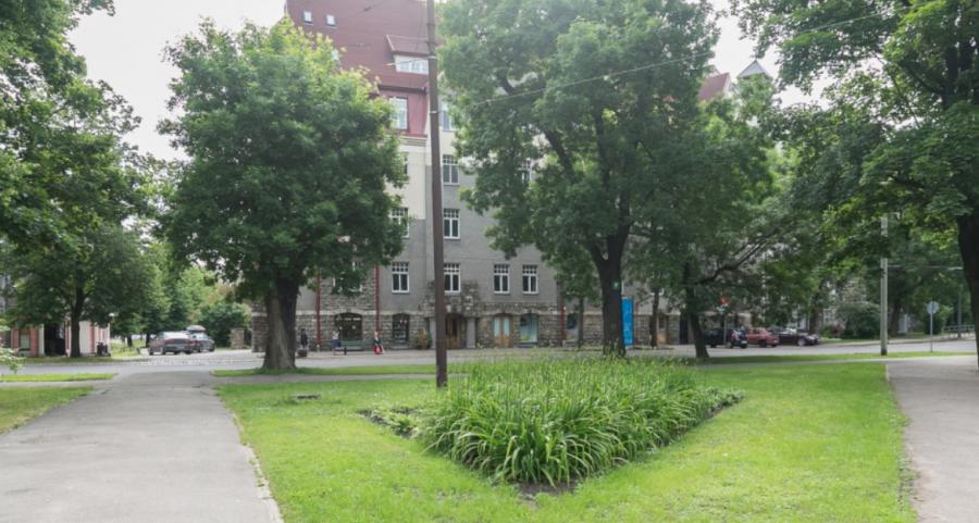 Spacious living room with large windows facing the Daugava River. 