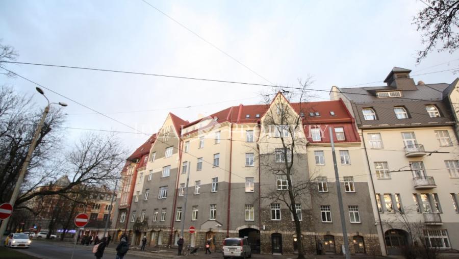 Spacious living room with large windows facing the Daugava River. 