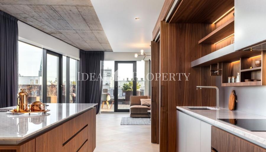 We offer for sale a designer apartment in the city center.