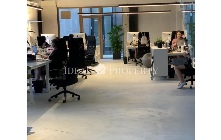 Open-plan office space is offered for rent in the renovated wooden building project 