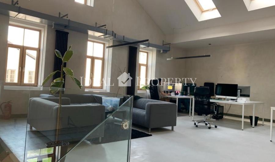 Open-plan office space is offered for rent in the renovated wooden building project 