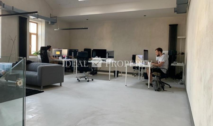 Open-plan office space is offered for rent in the renovated wooden building project 