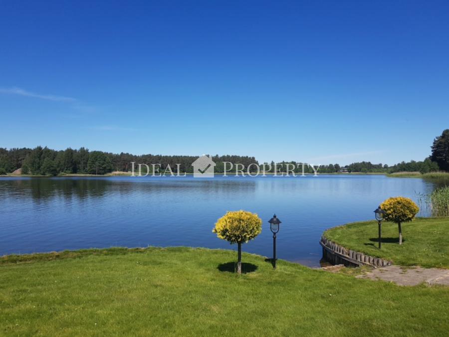 For sale a beautiful and cozy house on the lake in an elite village. 