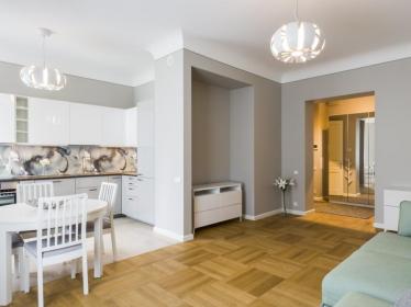 Three rooms, bedroom with private bedroom and dressing-room, separate room, bathroom with shower, maintenance room, big living room combined with the kitchen.  Property. Riga. Jurmala. Latvia.